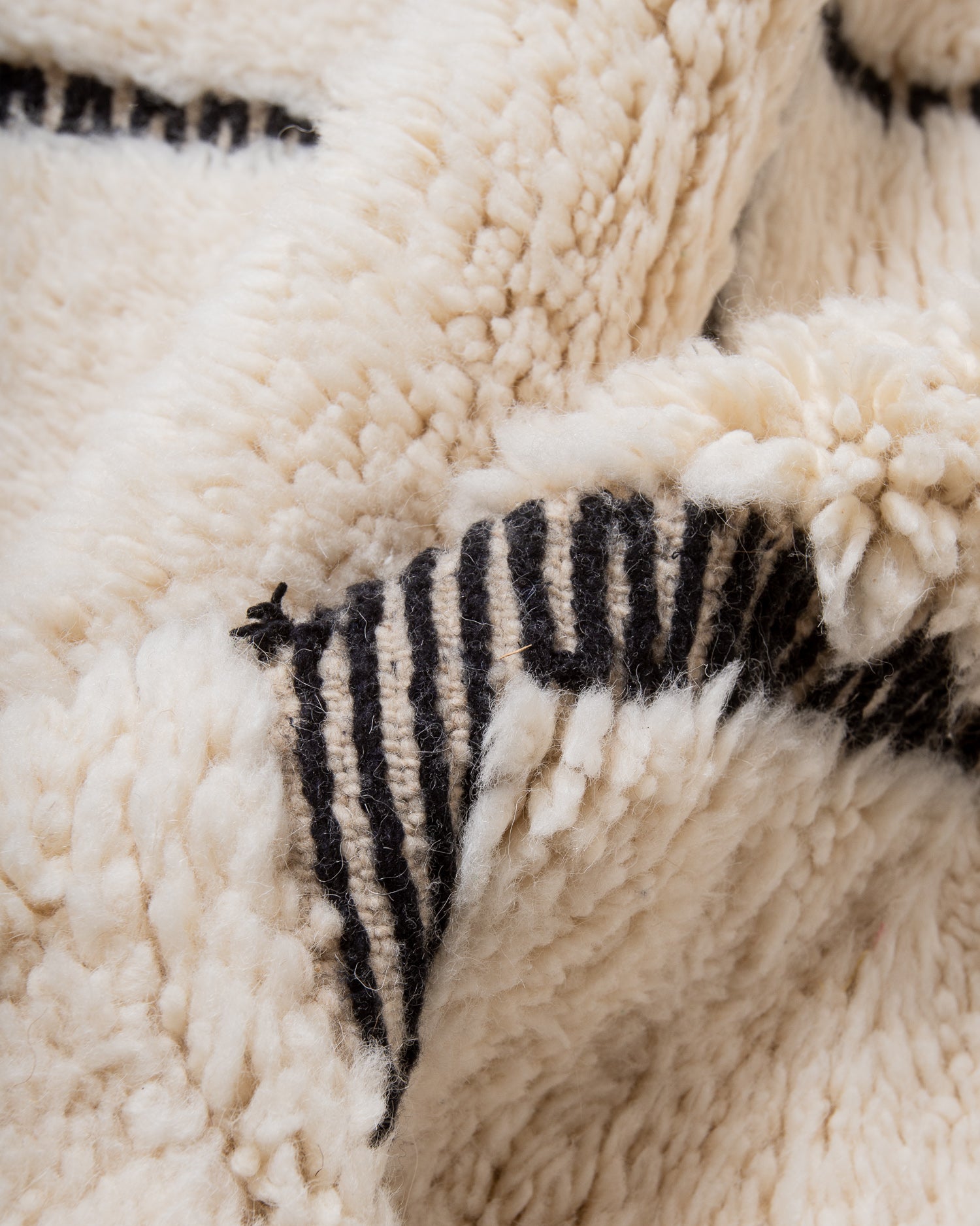 Modern, designer, handcrafted Berber rug from Morocco. Beniourain carpet with beautiful colours and patterns and fluffy wool texture.